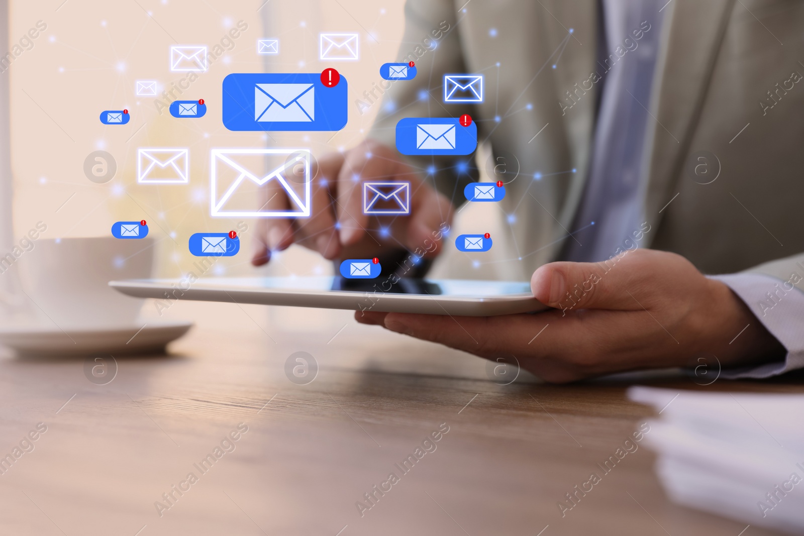 Image of Businessman sending emails at wooden table in office, closeup