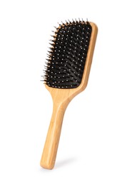 One new wooden hairbrush isolated on white