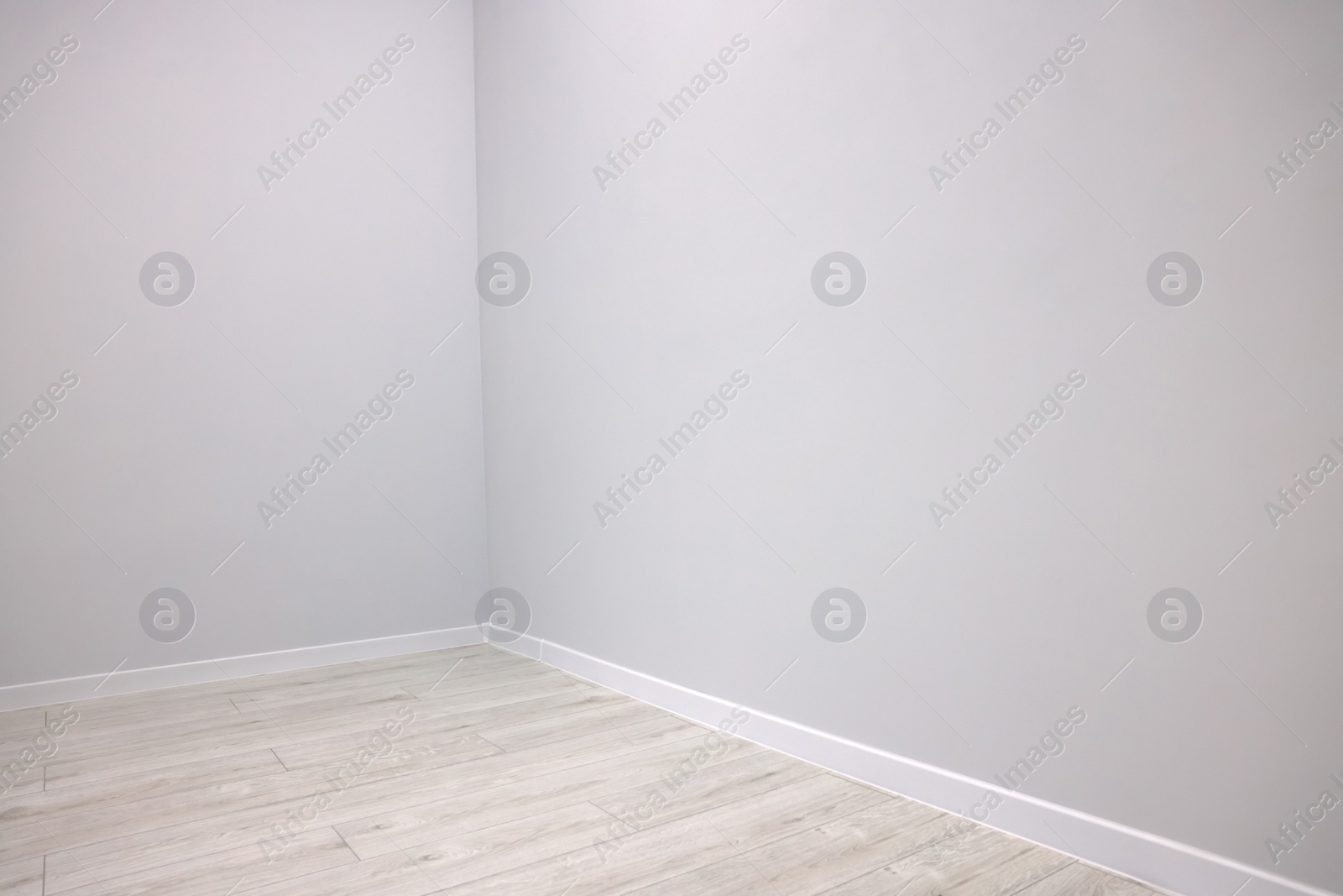 Photo of Empty renovated room with clean light walls