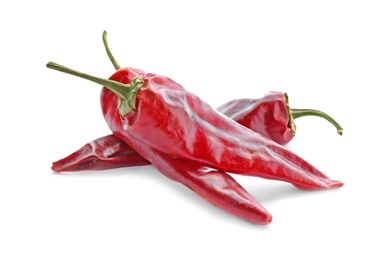 Photo of Dry chili peppers on white background