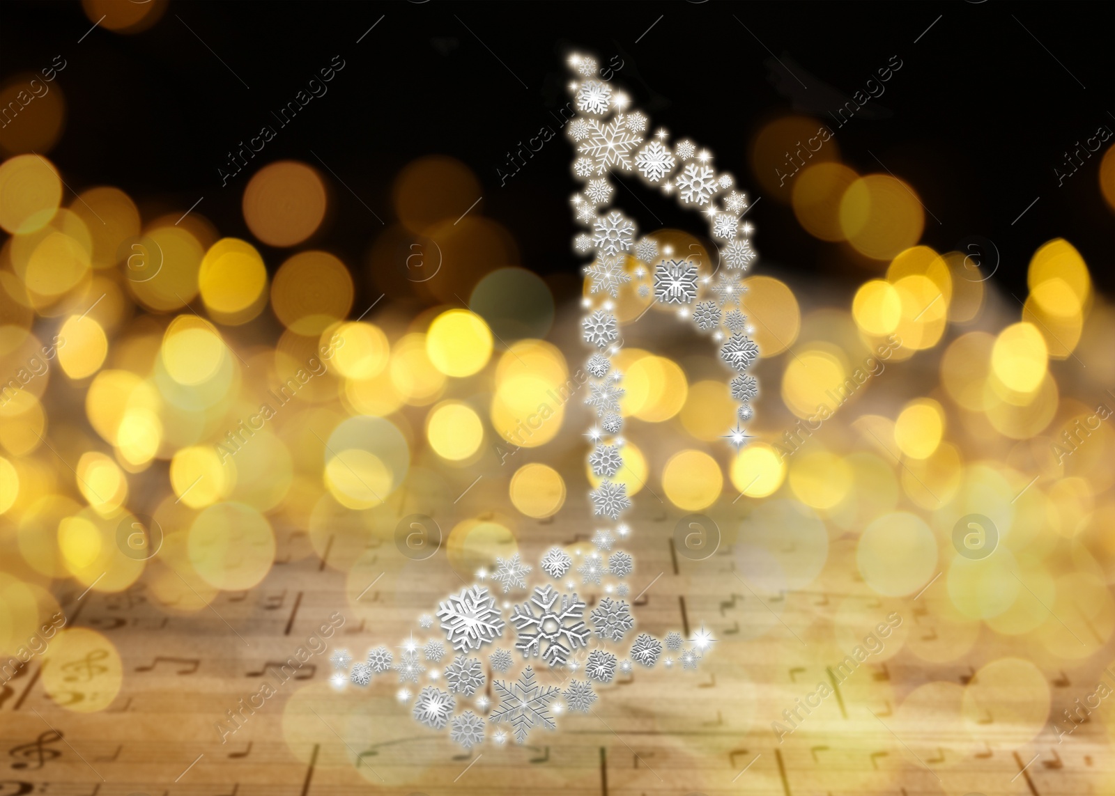 Image of Music note made of snowflakes over sheet with musical symbols. Bokeh effect