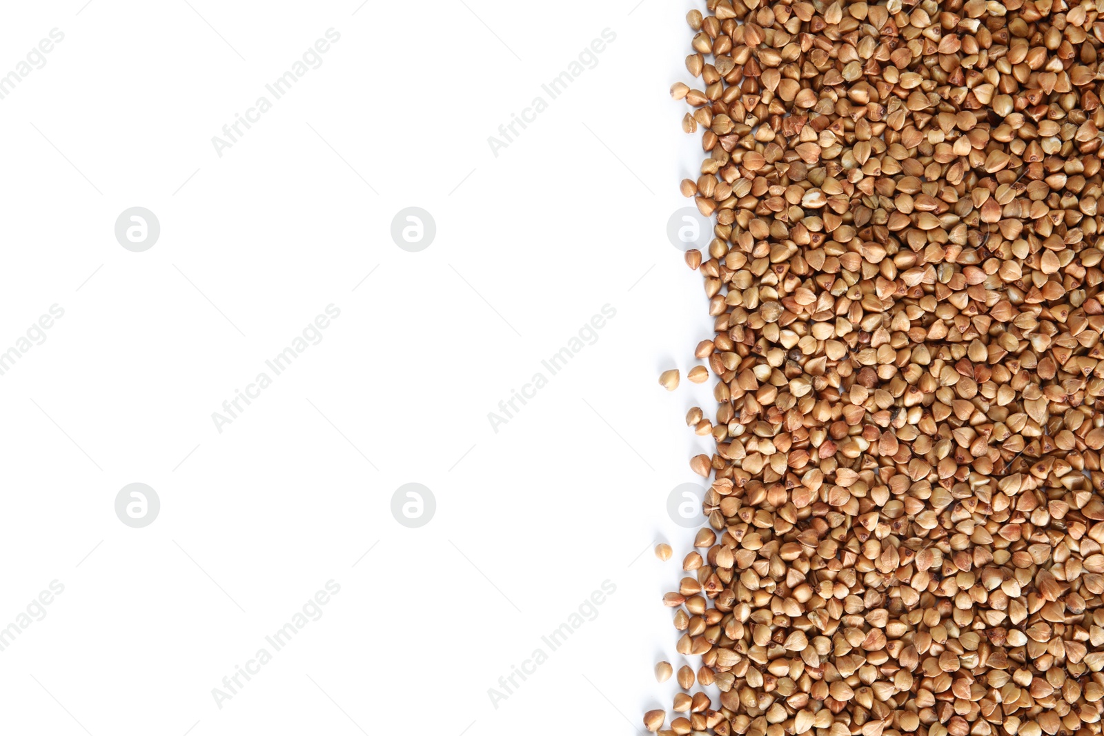 Photo of Uncooked buckwheat on white background, top view