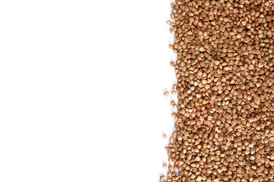 Photo of Uncooked buckwheat on white background, top view