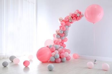 Light room decorated with colorful balloons for party