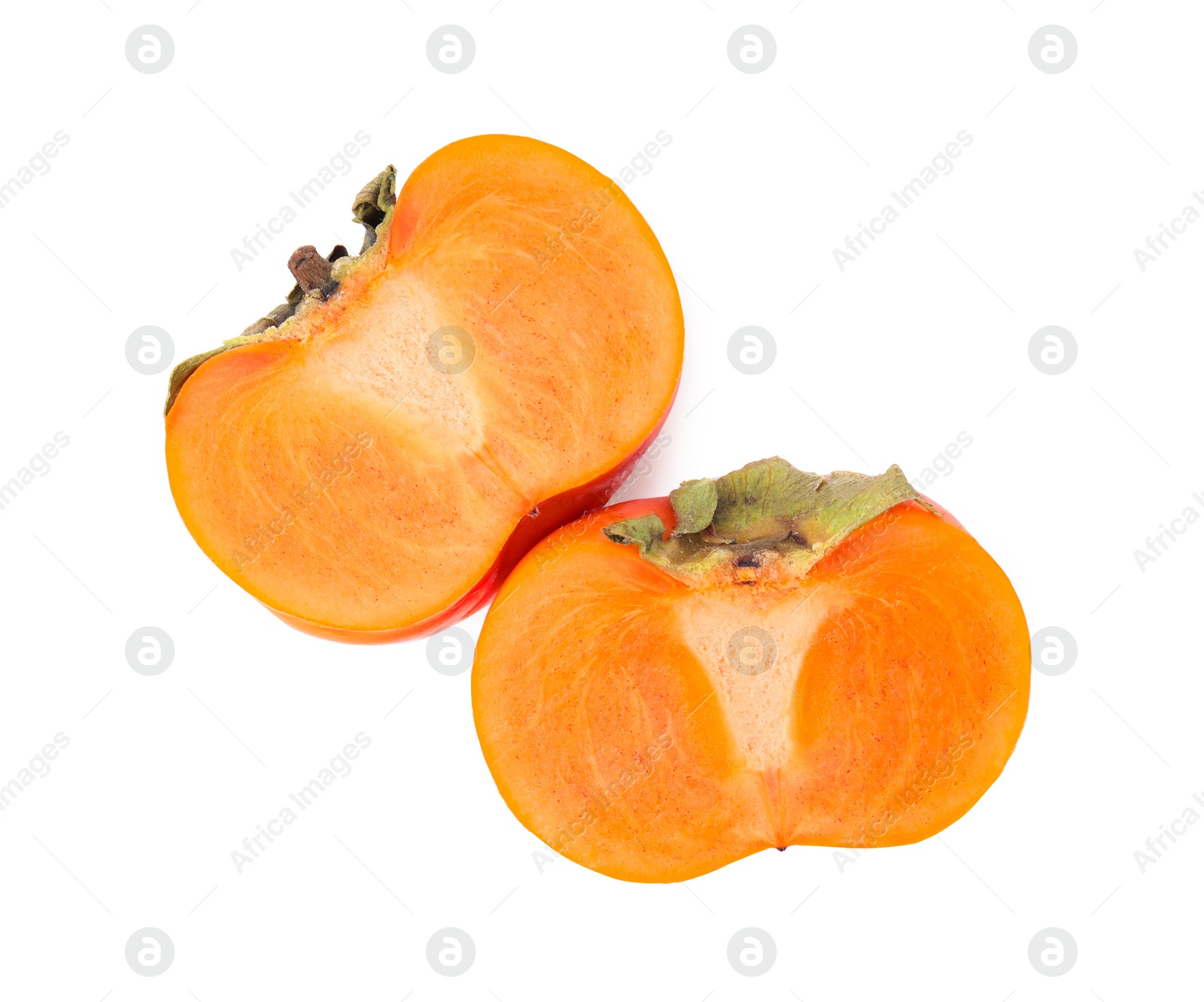 Photo of Halves of delicious ripe juicy persimmons on white background, top view