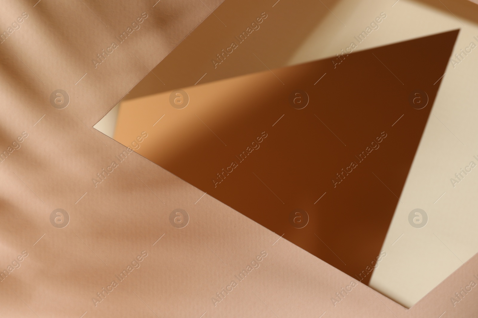 Photo of Presentation of product. Glass surface and shadows on pink background, above view