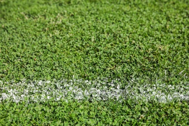 Photo of Fresh green football field grass as background