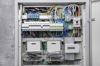 Photo of Fuse box with many electric meters and wires
