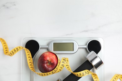 Photo of Flat lay composition with scales on white marble table, space for text