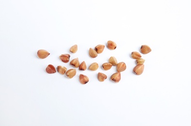 Uncooked buckwheat on white background, top view