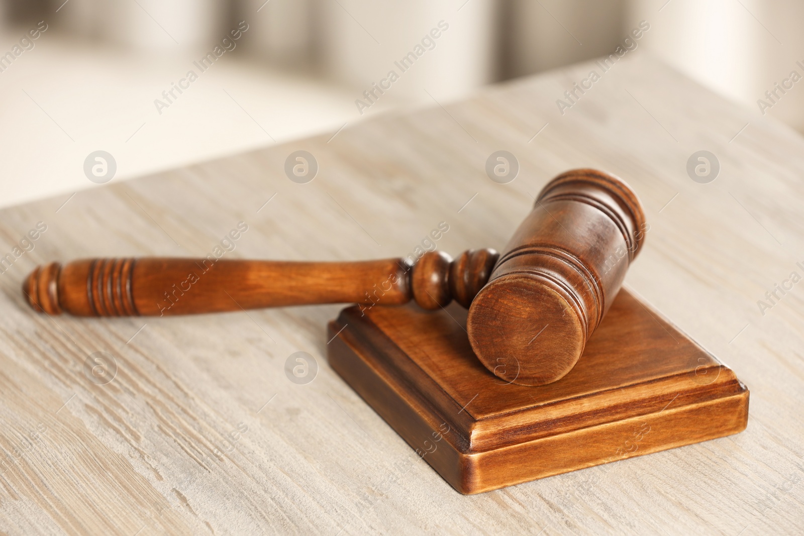 Photo of Law concept. Gavel on wooden table, closeup