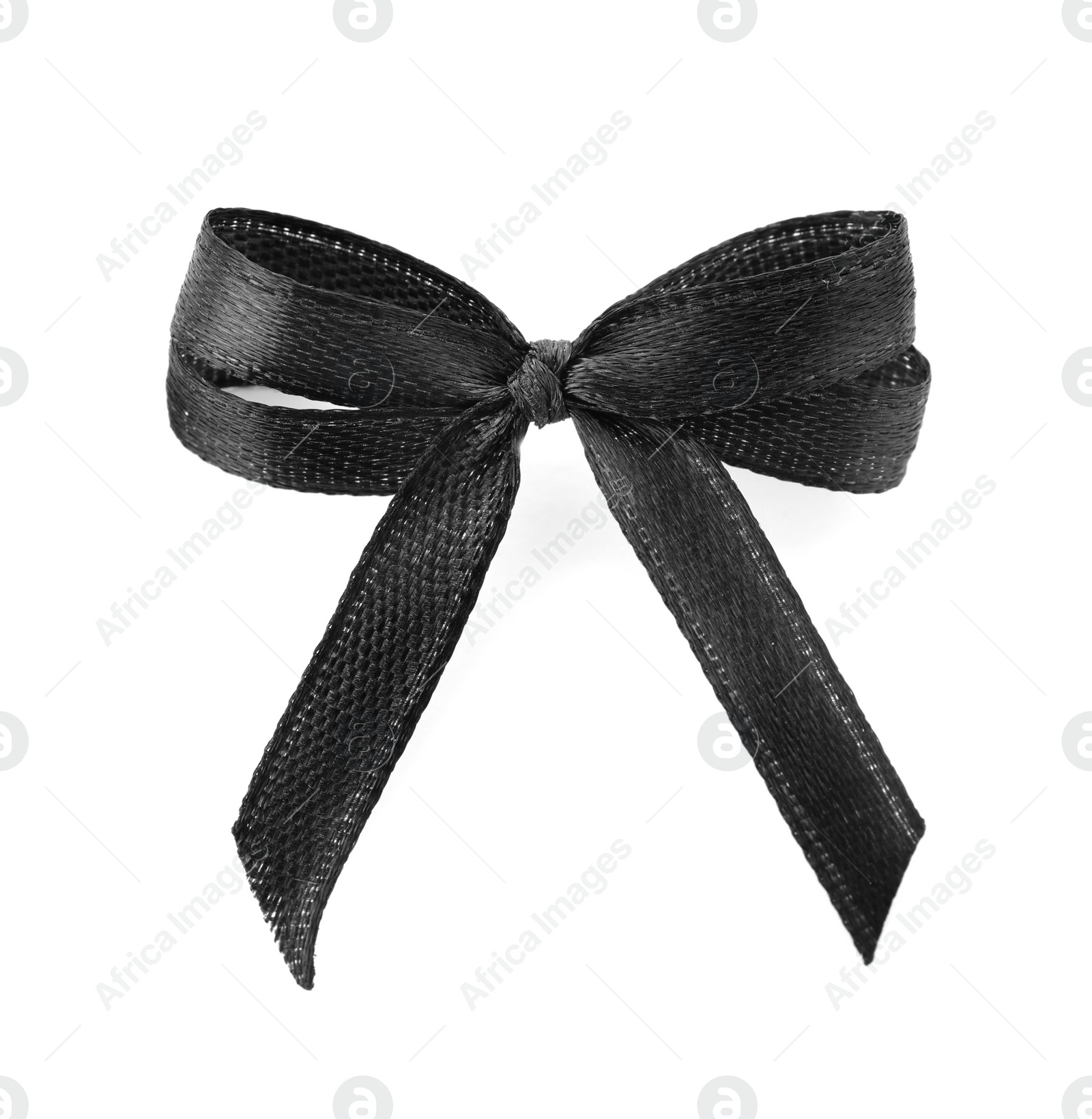 Photo of Black ribbon bow on white background, top view. Funeral symbol