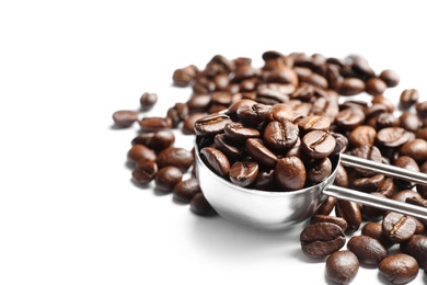 Photo of Scoop and roasted coffee beans on white background, closeup