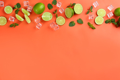 Photo of Lemonade layout with juicy lime slices, mint and ice cubes on coral background, top view. Space for text