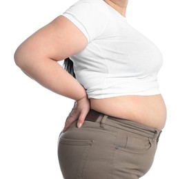 Overweight woman in tight t-shirt and trousers on white background, closeup