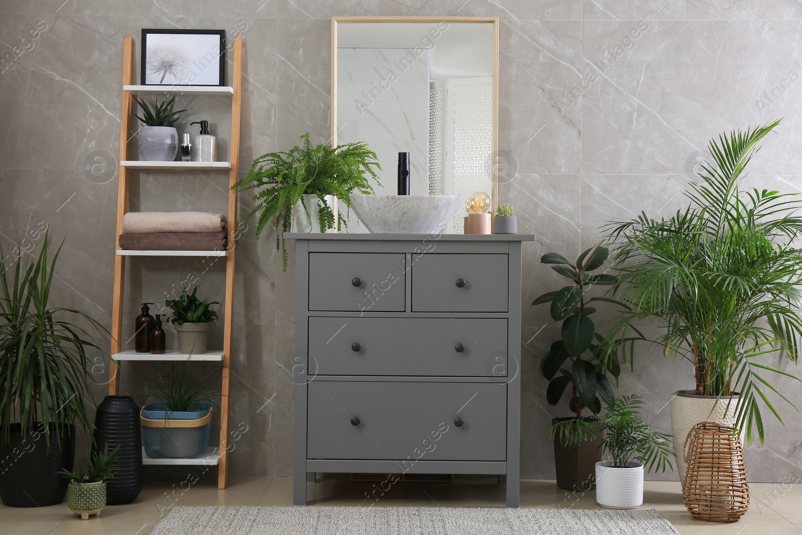 Photo of Modern bathroom interior with stylish vessel sink and beautiful green houseplants