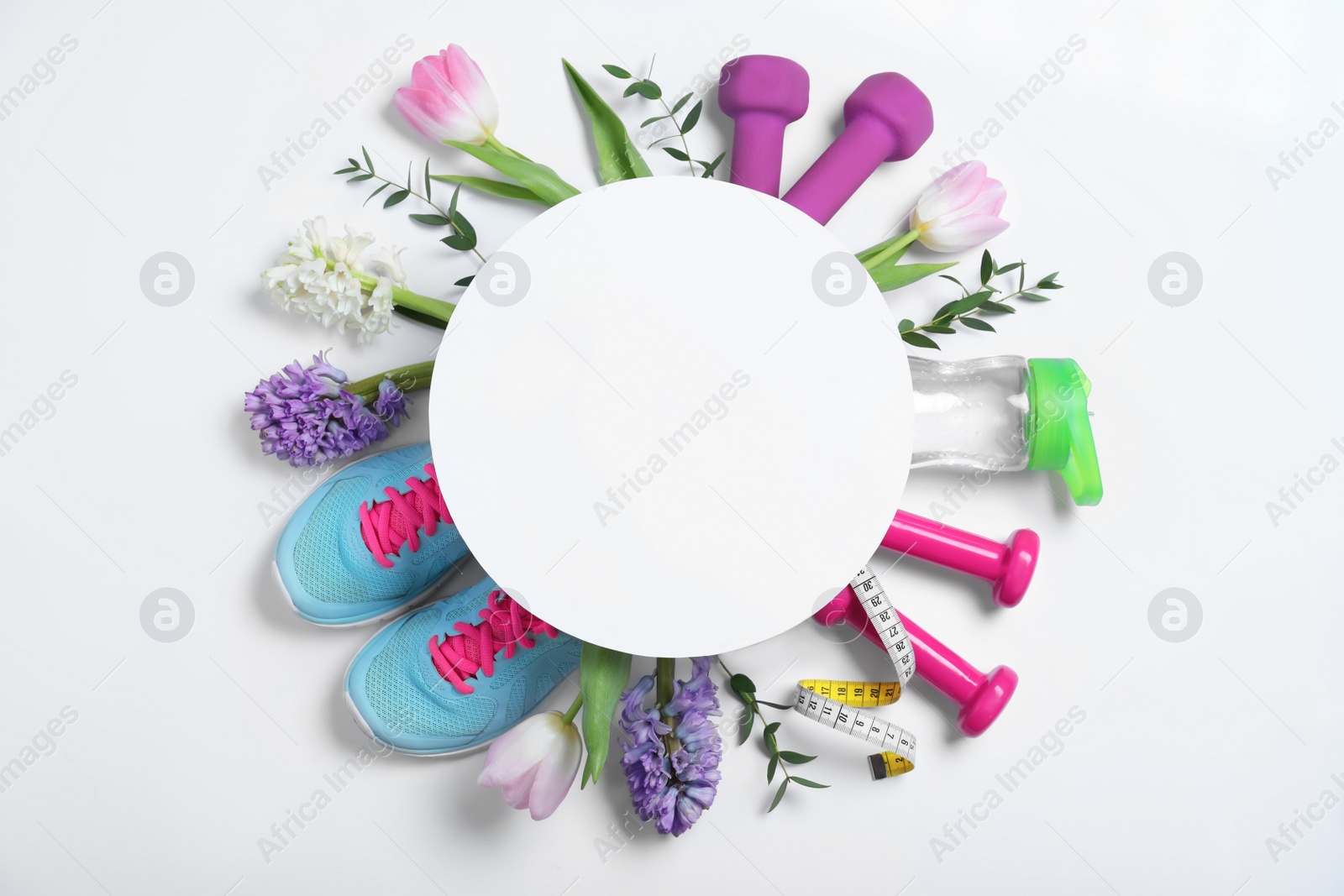 Photo of Composition with spring flowers, sports items and blank card on white background, top view. Space for text