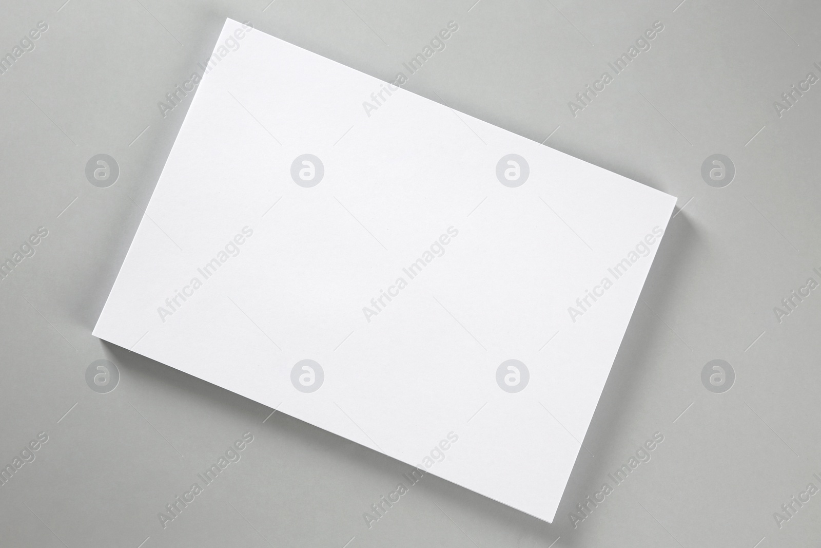 Photo of Blank brochure on grey background, top view. Mockup for design