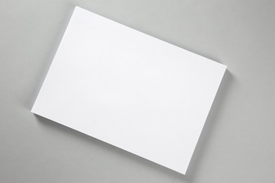 Photo of Blank brochure on grey background, top view. Mockup for design
