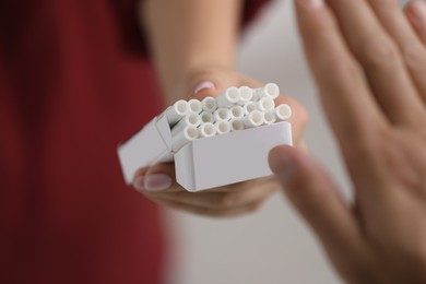 Photo of Stop smoking concept. Man refusing cigarettes, closeup