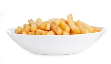 Plate with tasty French fries on white background