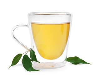 Photo of Fresh green tea in glass mug and leaves isolated on white