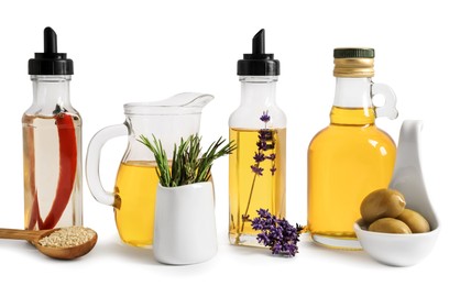 Photo of Different cooking oils and ingredients on white background