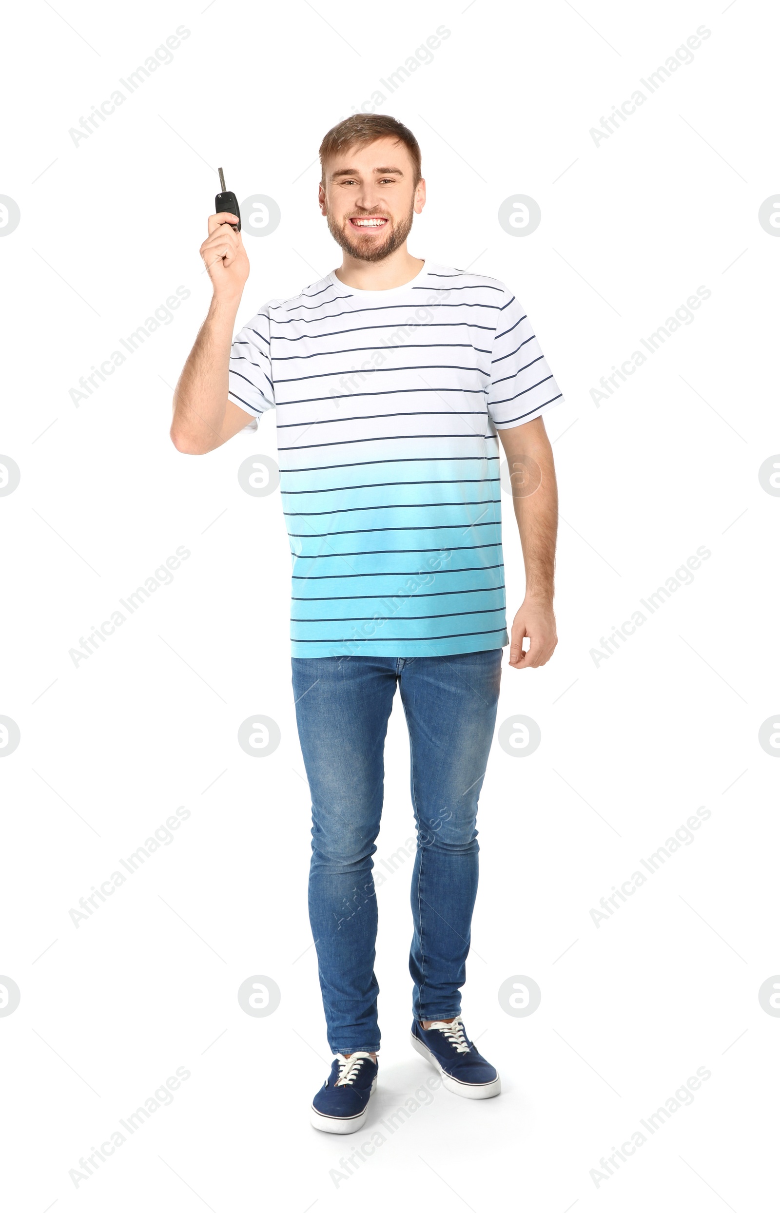 Photo of Happy young man with car key on white background. Getting driving license