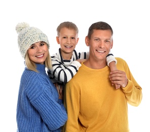 Photo of Happy family with child in warm sweaters on white background. Winter season