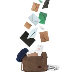 Many different envelopes falling into brown postman's bag on white background