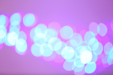 Photo of Beautiful glowing lights as background. Bokeh effect