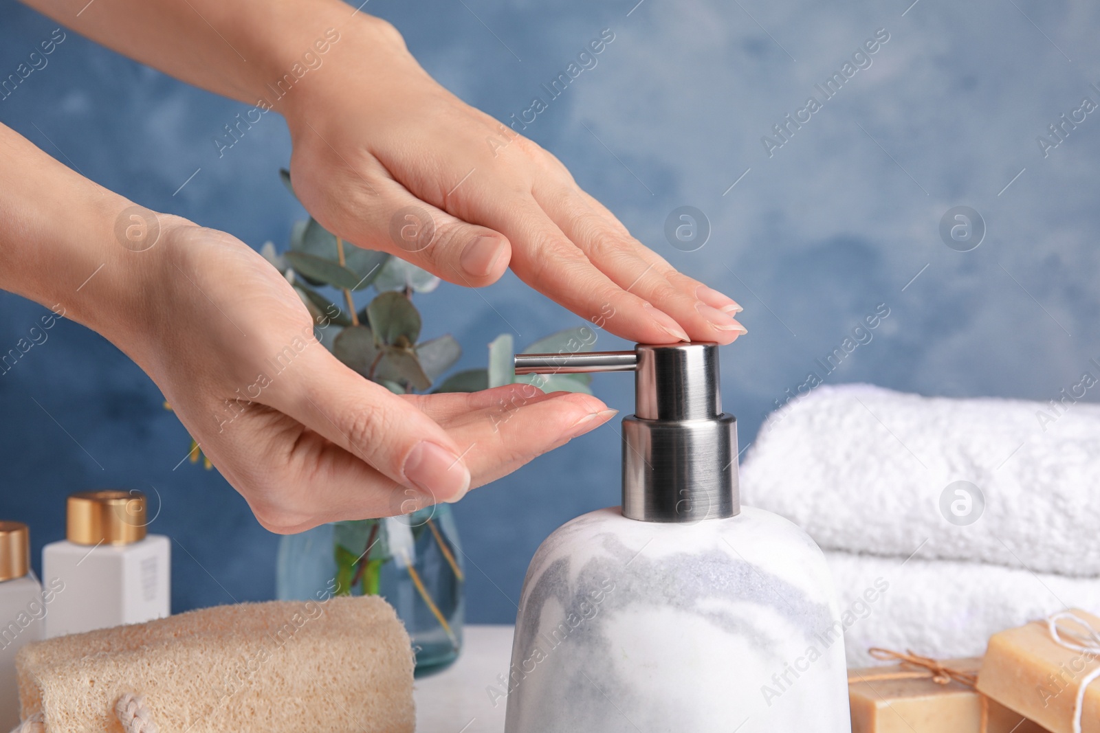 Photo of Woman using soap dispenser indoors, closeup view