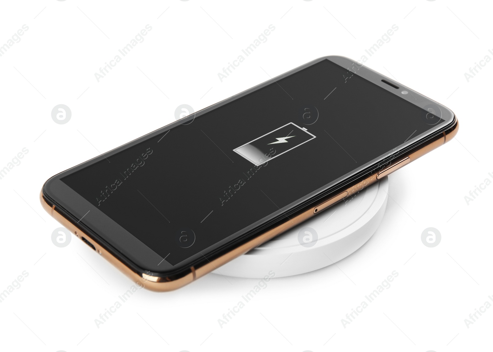 Photo of Mobile phone charging with wireless pad isolated on white