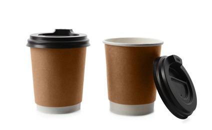 Takeaway paper coffee cups with lids on white background