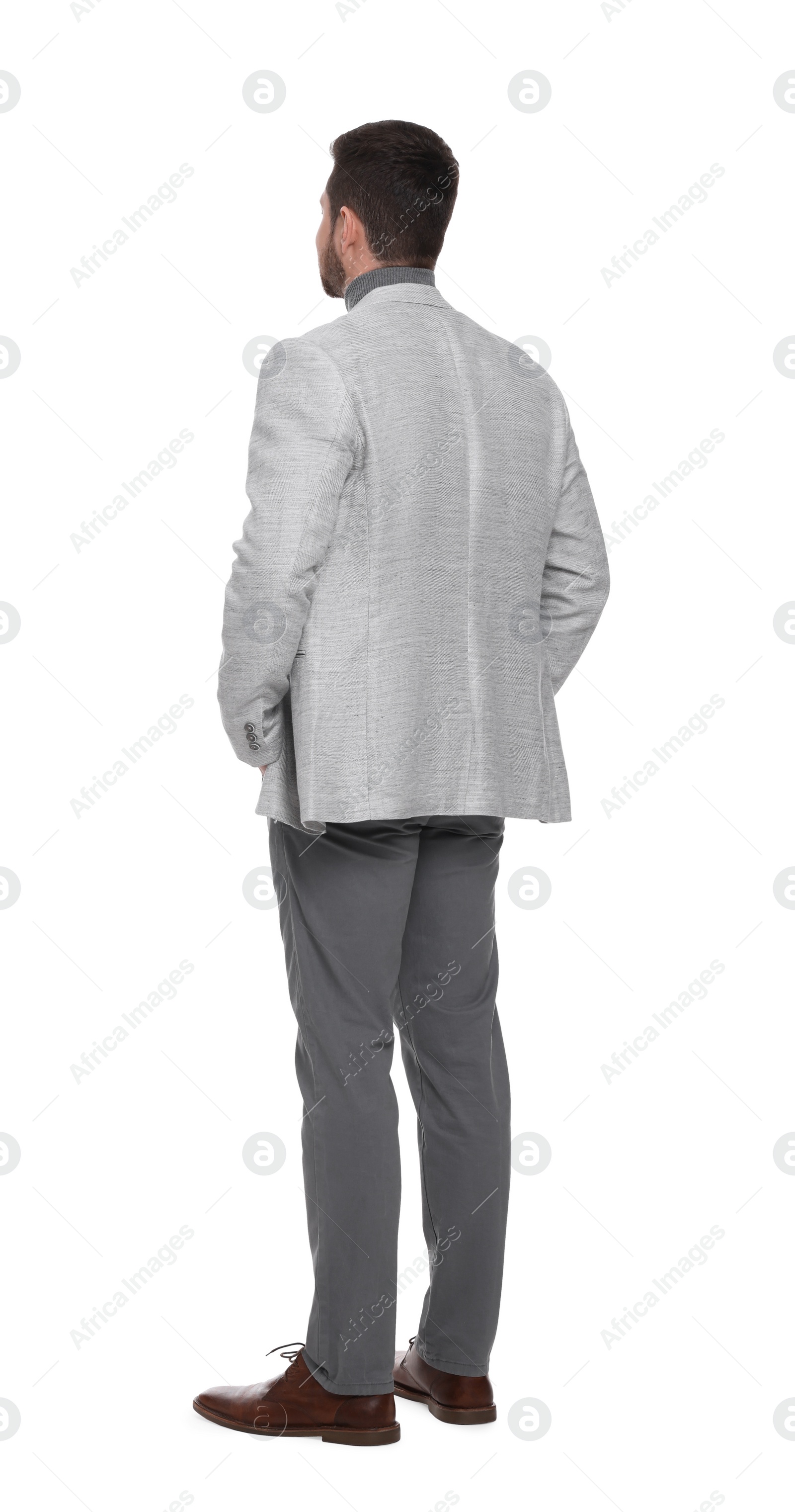 Photo of Businessman in suit standing on white background