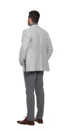 Businessman in suit standing on white background