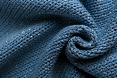 Photo of Beautiful pale blue knitted fabric as background, top view