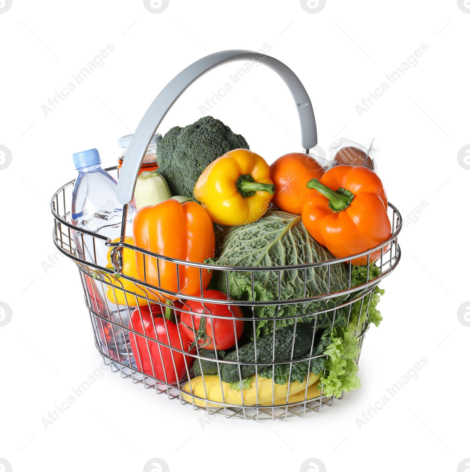 Photo of Shopping basket with grocery products on white background