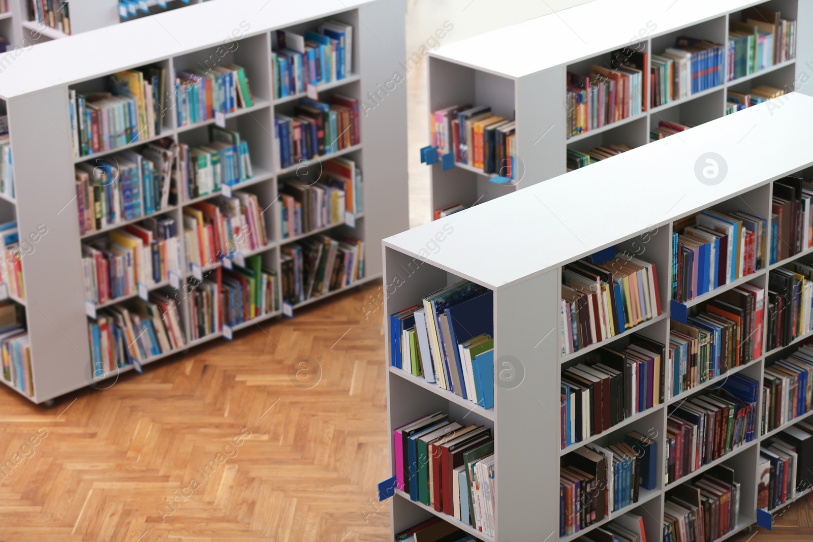 Photo of Above view of shelving units with books in library