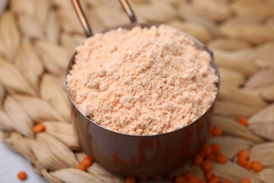 Organic lentil flour on wicker mat, closeup