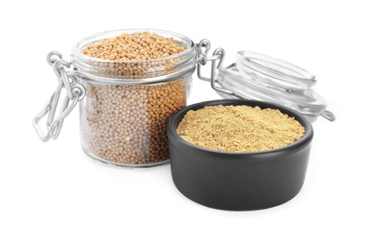 Photo of Aromatic mustard powder in bowl and glass jar with seeds on white background