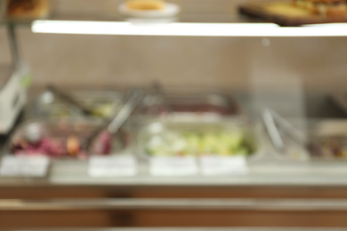 Photo of Blurred view of serving line with food in school canteen