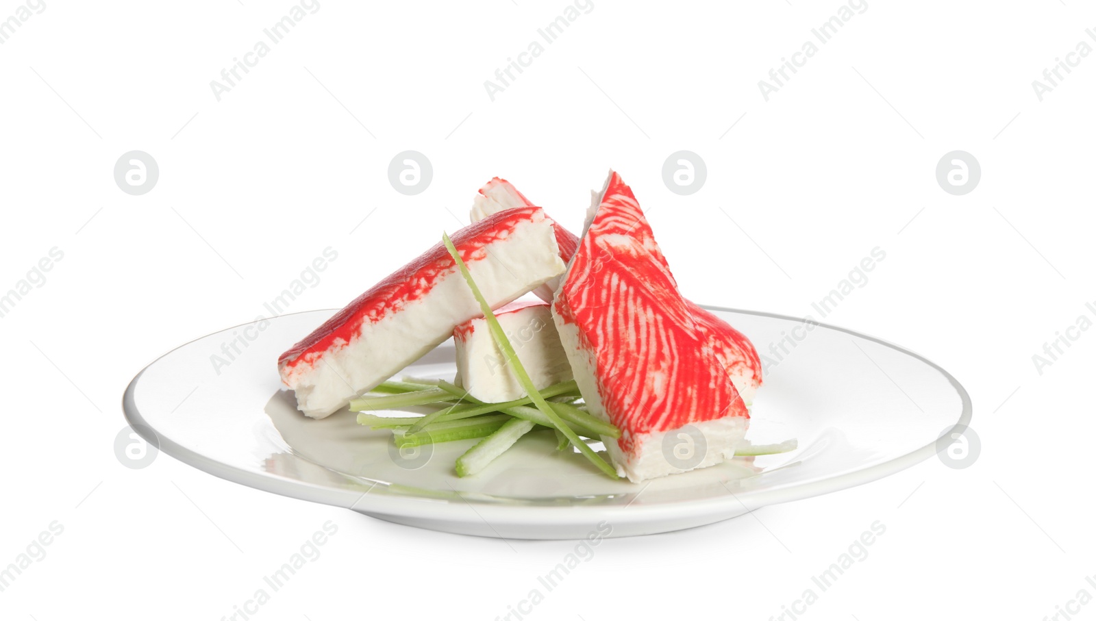 Photo of Plate with fresh crab sticks and cucumber isolated on white