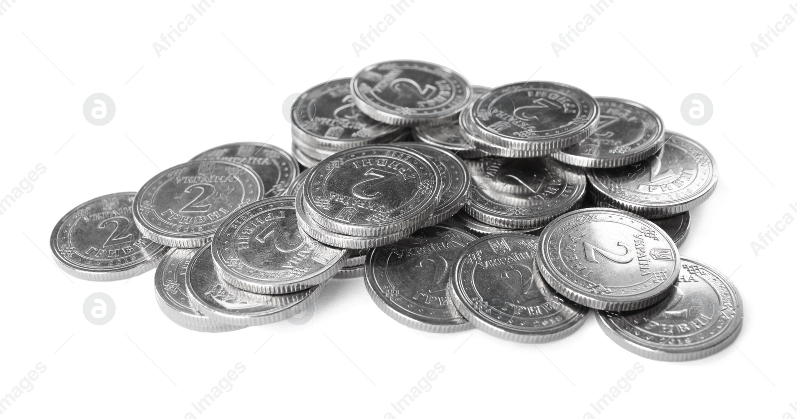 Photo of Many Ukrainian coins on white background. National currency