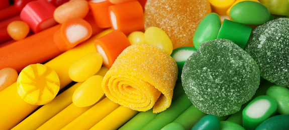 Image of Delicious colorful chewing candies as background. Banner design 