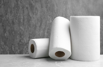 Photo of Rolls of paper towels on marble table