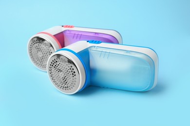 Modern fabric shavers on light blue background