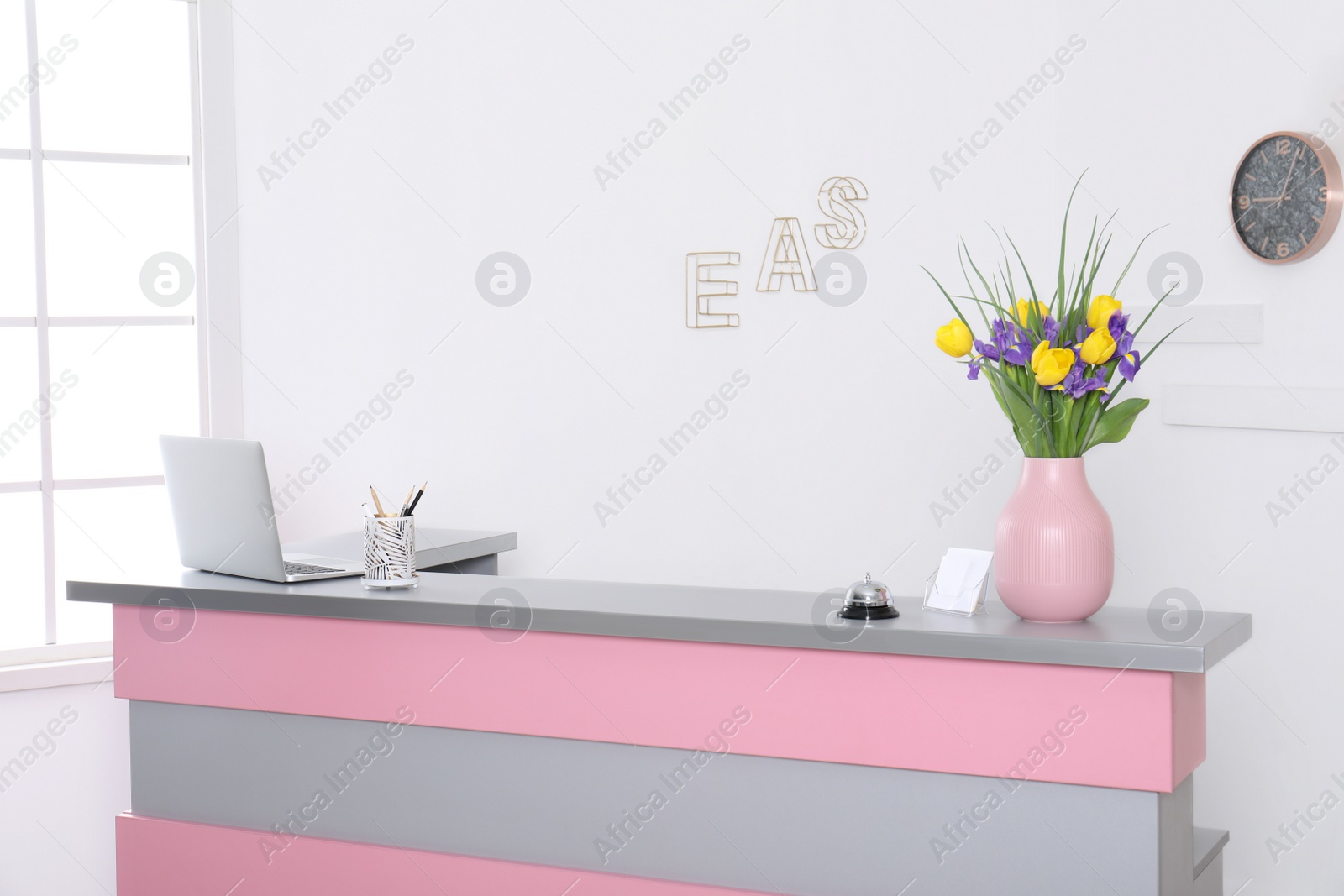 Photo of Modern reception desk in beauty salon. Stylish interior