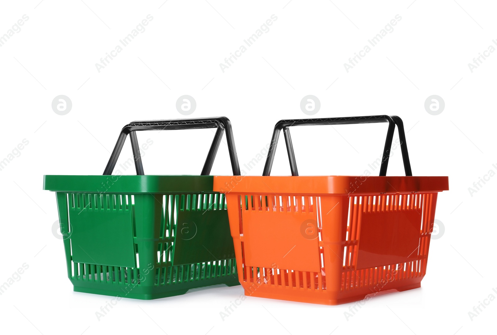 Photo of Color plastic shopping baskets isolated on white