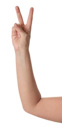 Photo of Playing rock, paper and scissors. Woman making scissors with her fingers on white background, closeup